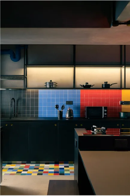 Dark kitchen cabinetry and colour-block material detailing in a 5-Room BTO interior at Punggol by Singapore Interior Designers The Local INN.terior