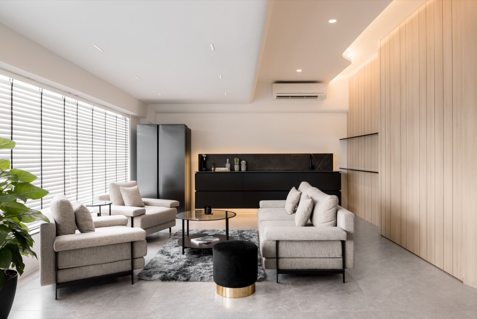 Gardens Showroom commercial interior with light timber joinery, lounge seating and integrated display storage by The Local INN.terior