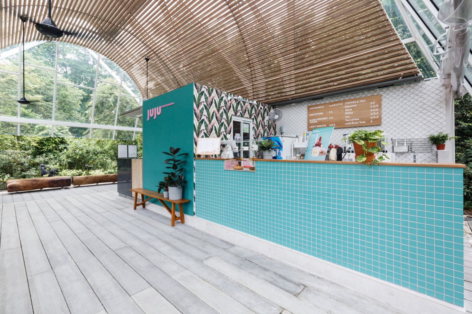 Juju cafe at Botanic Gardens with turquoise tiled counter, open frontage and tropical setting by The Local INN.terior